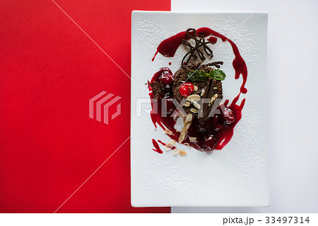 Chocolate cake on contrast colorful background 33497314