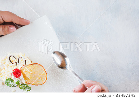 Tasting creamy orange dessert in restaurant Tasting creamy orange dessert in restaurant 33497345