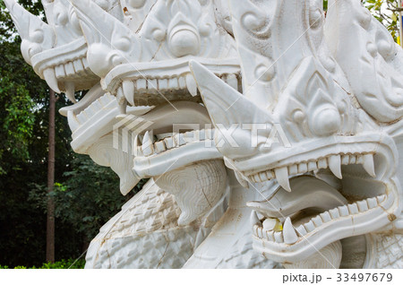 Fragment of white ceramic naga snake statue 33497679