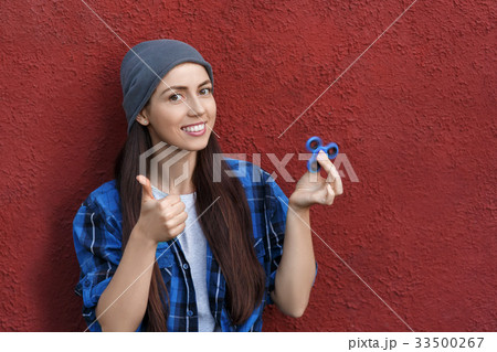 girl with fidget spinner girl with fidget spinner 33500267