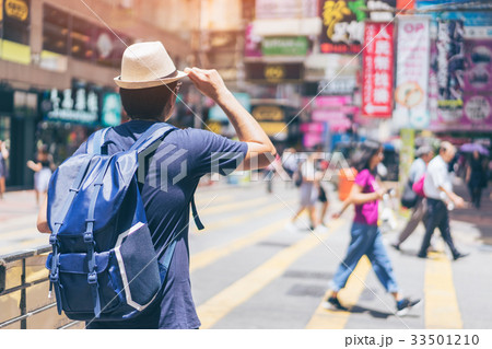 Young man traveler is visiting at Mongkok in Hong Kong 33501210