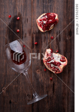 Pomegranate on a wooden background Pomegranate on a wooden background 33502890