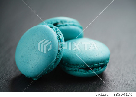 bright azure macarons on slate background 33504170