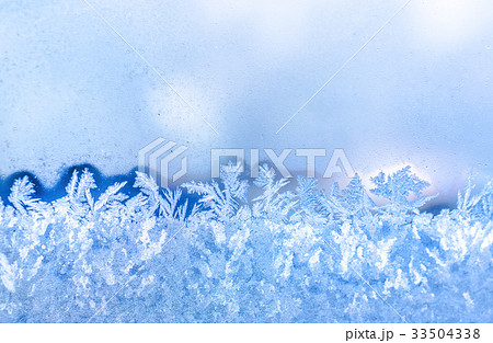 blue frost on window festive background, close up 33504338