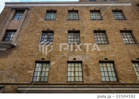Old brick building with many windows 33504592