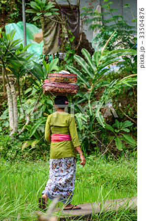 People visit the local temple in Bali, Indonesia 33504876