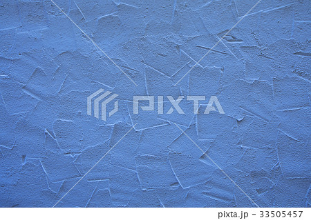 Blue wall of embossed decorative plaster Blue wall of embossed decorative plaster 33505457