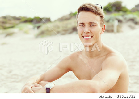 Handsome man posing at beach 33512332