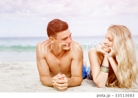 Romantic young couple on the beach Romantic young couple on the beach 33513683