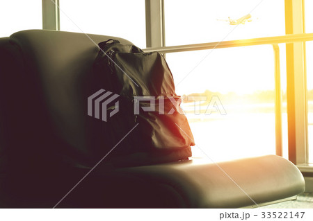 backpack was placed at the airport seat. backpack was placed at the airport seat. 33522147
