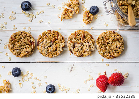 Homemade granola bar and fresh berries on wood 33522339