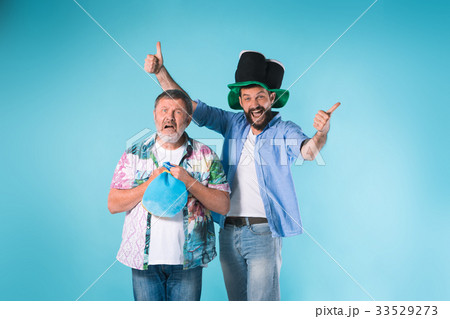 The two football fans over blue 33529273