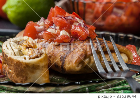 Mexican chimichanga with salsa dip 33529644