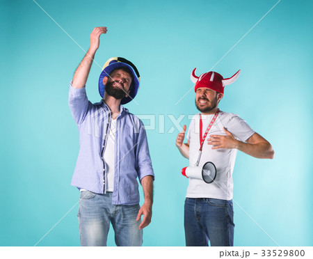 The two football fans over blue 33529800