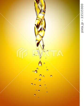 transparent glass pipette with a Golden liquid 33535900