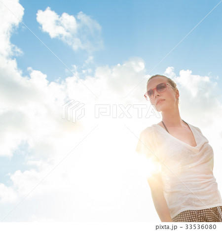 Confident relaxed casual woman enjoying summer. 33536080