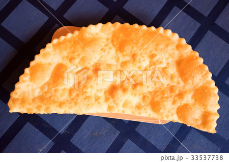 Chebureki or fried pie with meat close up 33537738