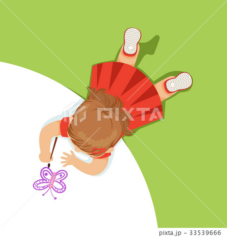 Little girl lying on her stomach and painting a 33539666