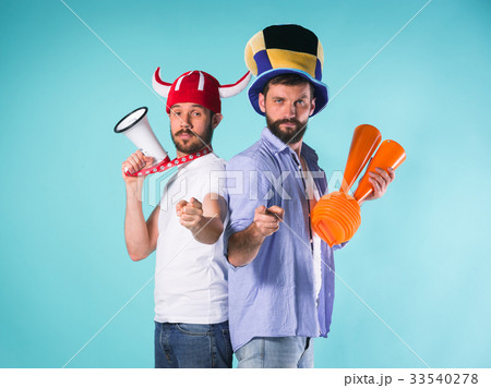The two football fans over blue 33540278