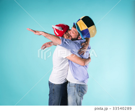 Two Excited Male Friends Celebrate Watching Sports Two Excited Male Friends Celebrate Watching Sports 33540289