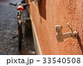 antique decorative window shutter and a blury bike 33540508