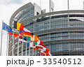 European Parliament building with flags 33540512