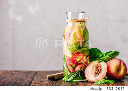 Infused Water with Peach and Basil. 33542035