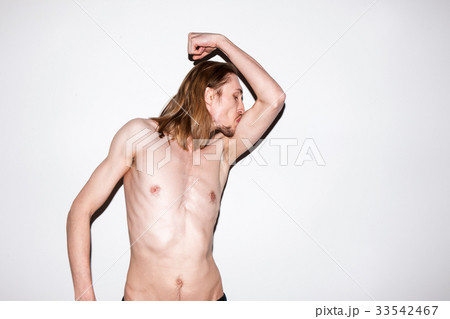 Adult man showing off his muscles Adult man showing off his muscles 33542467