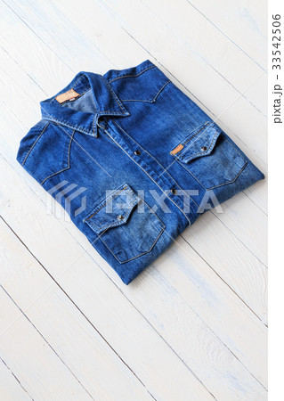 Blue denim jeans on brown wooden Blue denim jeans on brown wooden 33542506