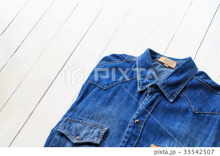 Blue denim jeans on brown wooden Blue denim jeans on brown wooden 33542507