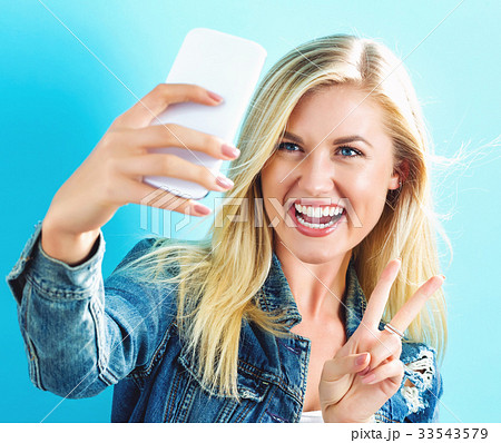 Young woman taking a selfie  33543579