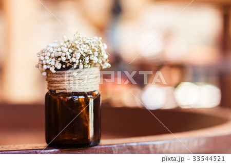 Dried flowers in glass bottle Dried flowers in glass bottle 33544521