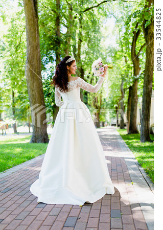 Portrait of very beautiful bride with the bouquet 33544825