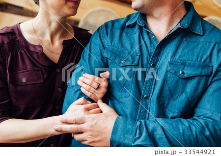 Happy love adult couple holding hands Happy love adult couple holding hands 33544921