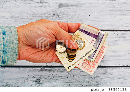 Male hand in old jacket holding money of Bulgaria Male hand in old jacket holding money of Bulgaria 33545138