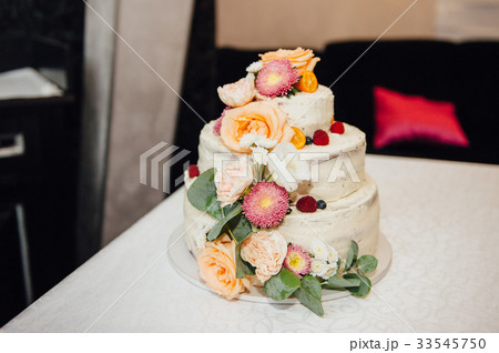 Beautiful delicious white wedding cake  33545750