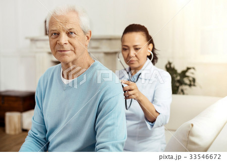 Pleasant elderly man having a medical examination 33546672