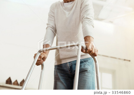 Professional walker helping the old man 33546860