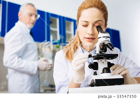 Competent practitioner doing reagent examination Competent practitioner doing reagent examination 33547350