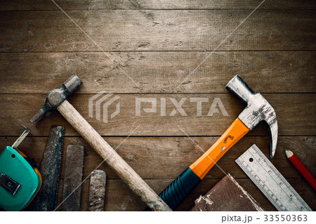 grunge tools on wooden background with empty space 33550363
