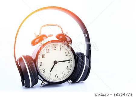 Retro black alarm clock with headphone isolated Retro black alarm clock with headphone isolated 33554773