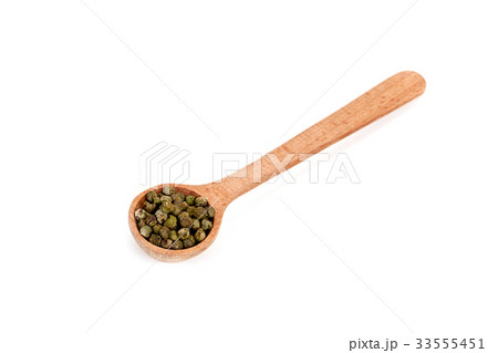 green pepper in wooden spoon 33555451