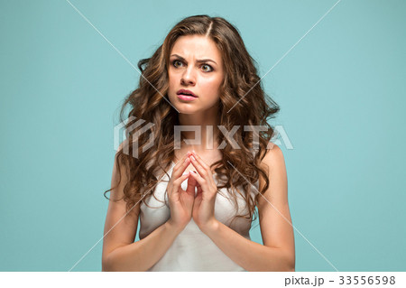 The young woman's portrait with sad emotions The young woman's portrait with sad emotions 33556598