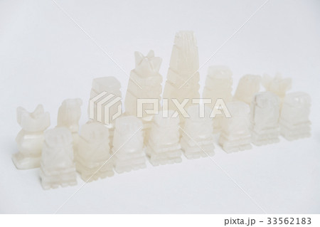 Stone old chess pieces on white background 33562183