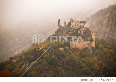 view of historic castle ruin, colorful autumn view of historic castle ruin, colorful autumn 33563977