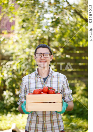 Photo of guy with tomato 33567012