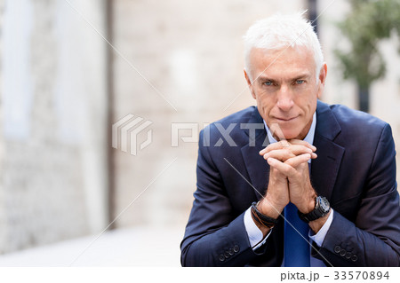 Portrait of confident businessman outdoors Portrait of confident businessman outdoors 33570894