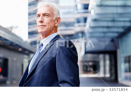 Portrait of confident businessman outdoors Portrait of confident businessman outdoors 33571854