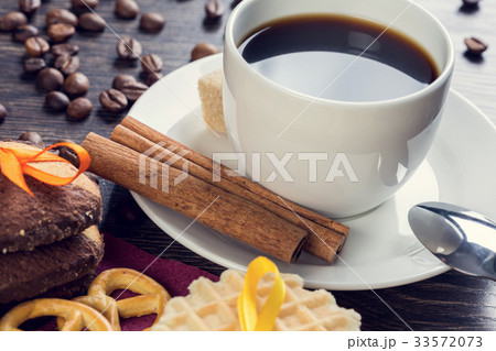 Biscuits and coffee on table 33572073
