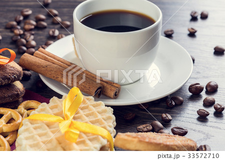 Biscuits and coffee on table 33572710